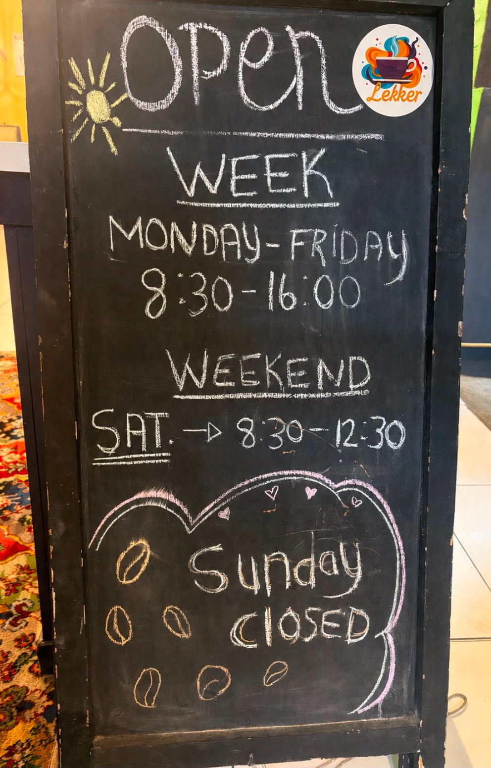 The hours chalkboard: open Monday to Friday 08:30 to 16:00, Saturday 08:30 to 12:30, closed Sundays