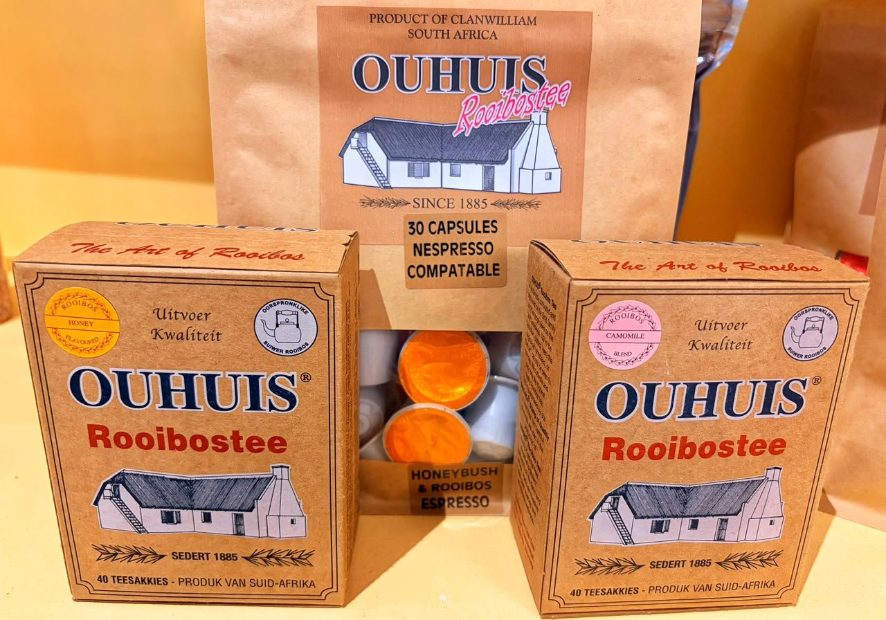 Boxes of Ouhuis Rooibos tea and Nespresso-compatible rooibos capsules