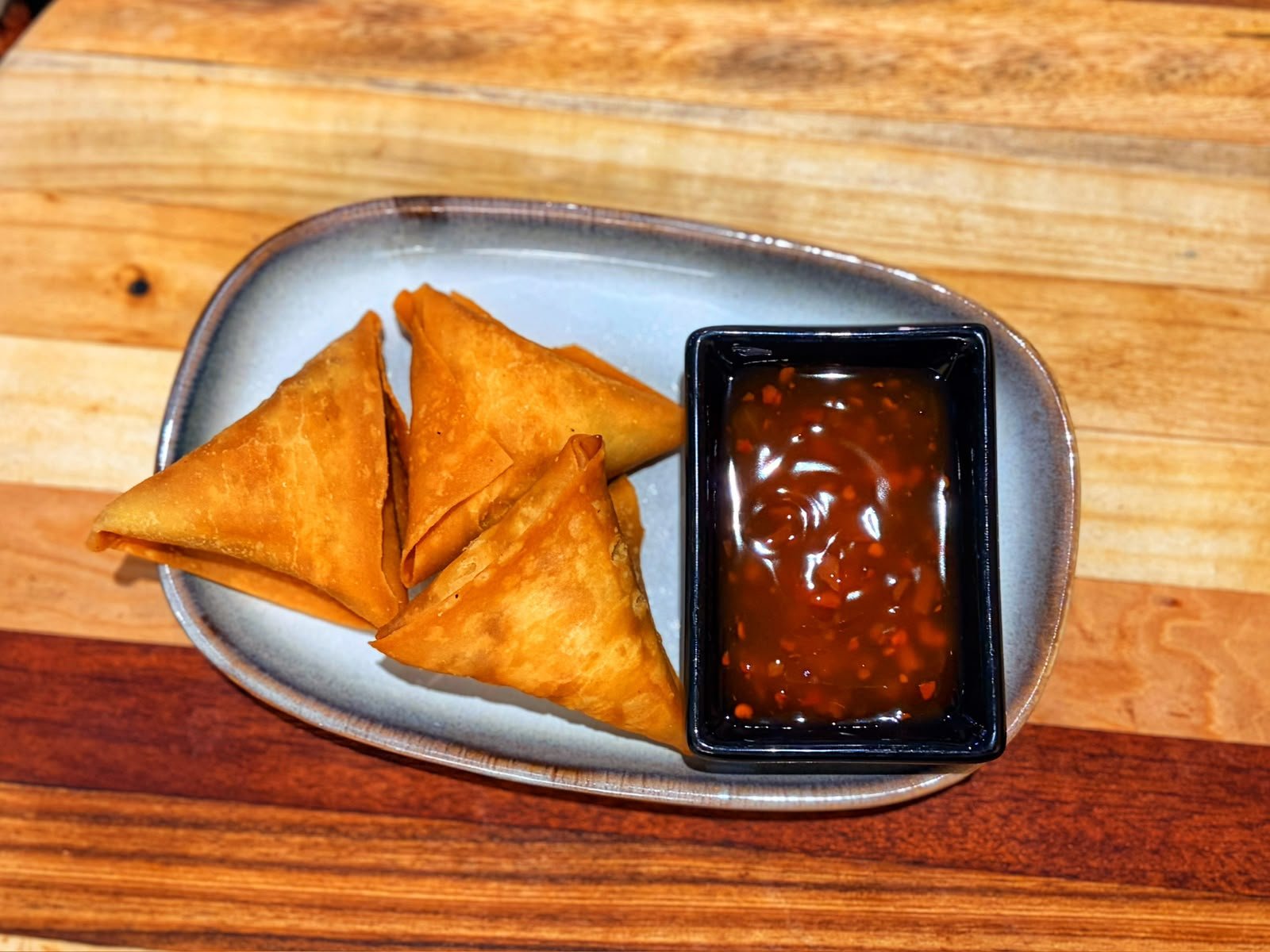 Samoosas served with sweet chilli sauce